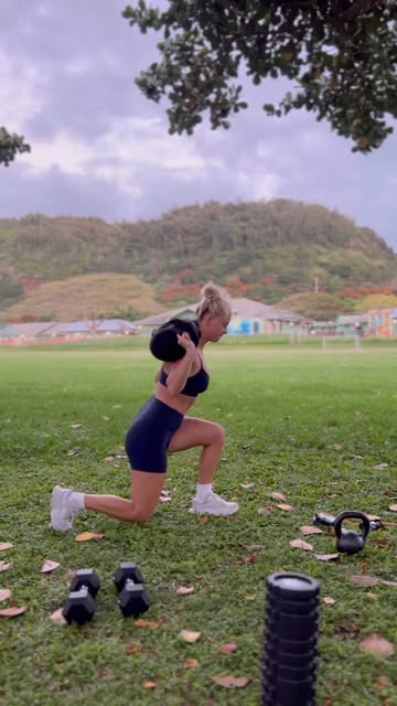 A participant performing a weighted lunge outdoors